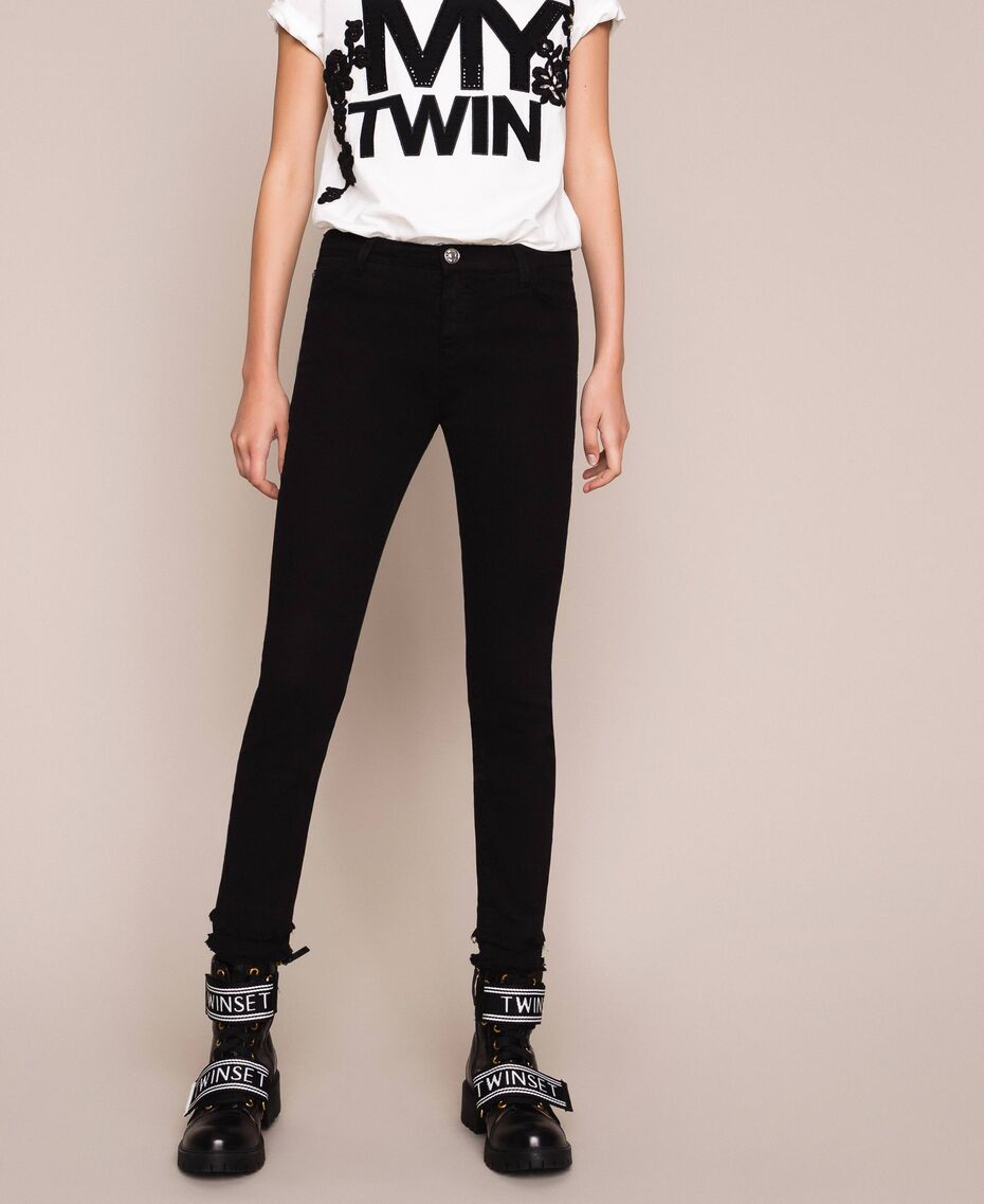 Pantaloni skinny con fondo sfrangiato / Nero - Ideal Moda