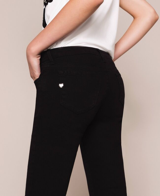 Pantaloni skinny con fondo sfrangiato / Nero - Ideal Moda
